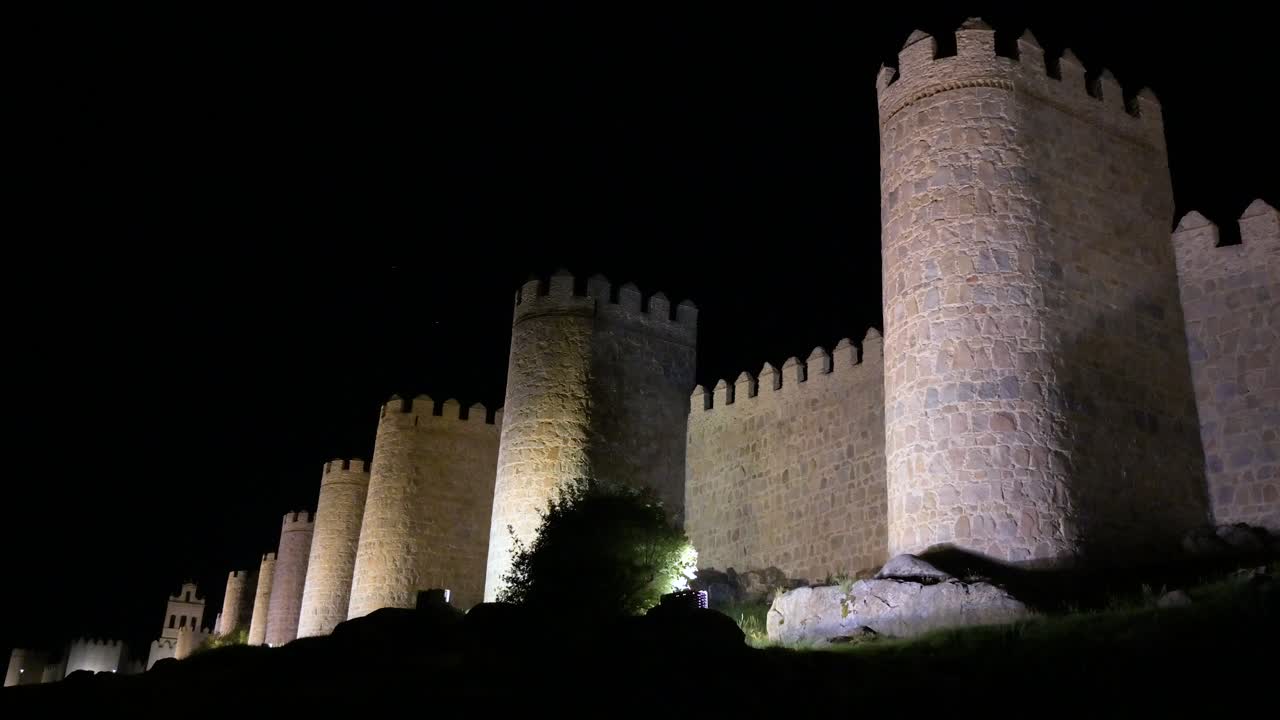 Avila at night, featuring the glowing medieval walls and ancient old town, recognized as a UNESCO World Heritage Site in Spain.