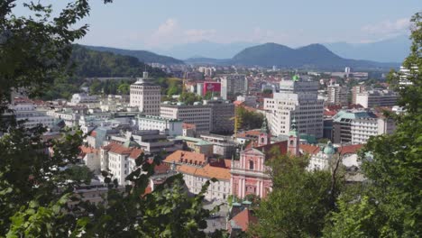 a panoramic view of downtown ljubljana with the alps visible in the background