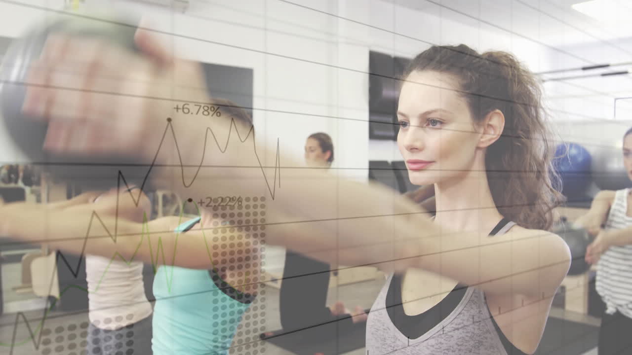 Exercising in gym, women with financial data graph animation overlaying scene