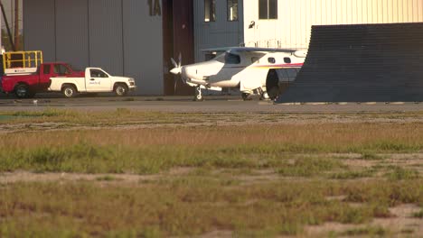 Small-Airplane-parked-on-tarmac-of-airport