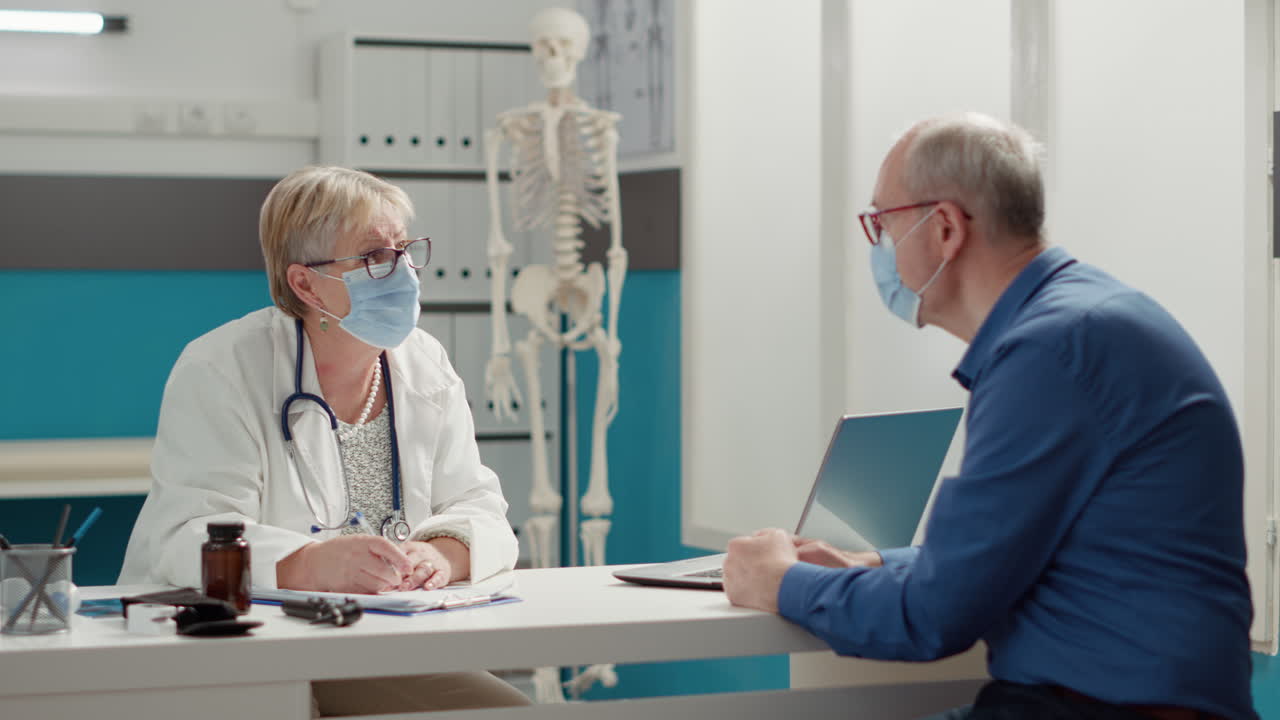 Specialist writing checkup visit report on documents in cabinet