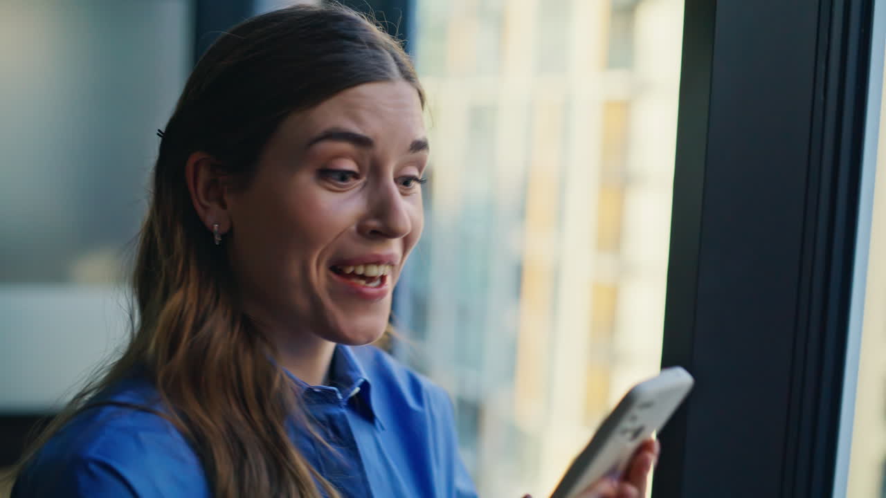 Excited woman receiving message on cellphone closeup. Lady rejoicing success