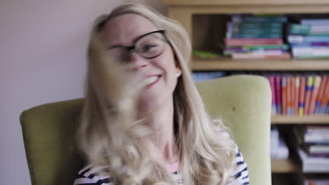 portrait of a smiling woman with glasses