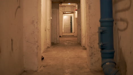 A-View-Of-Dirty-Walls-And-Empty-Walkway-At-the-Old-Basement