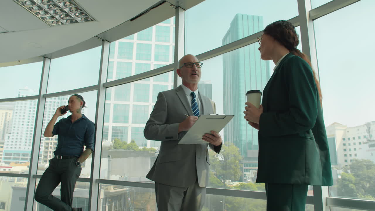 Coworkers Discussing Plan of Meeting during Coffee Break