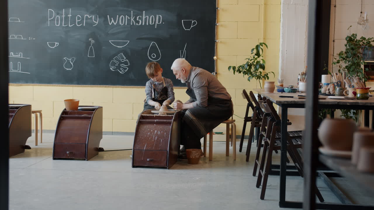 Grandfather and Grandson at a Pottery Workshop