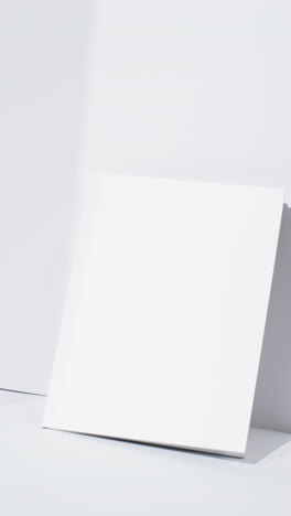 vertical video of book with blank pages and copy space on white background