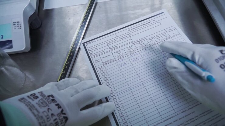 Filling out a lab report or data sheet