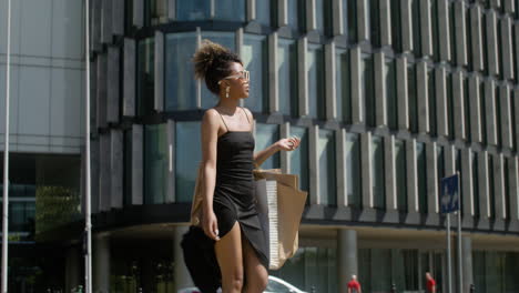 young fashionable african woman walking down the street