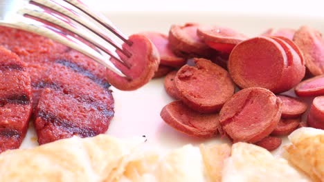 grilled sausage and sliced sausage on a plate