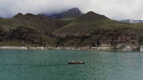 couple canoeing in a mountain lake