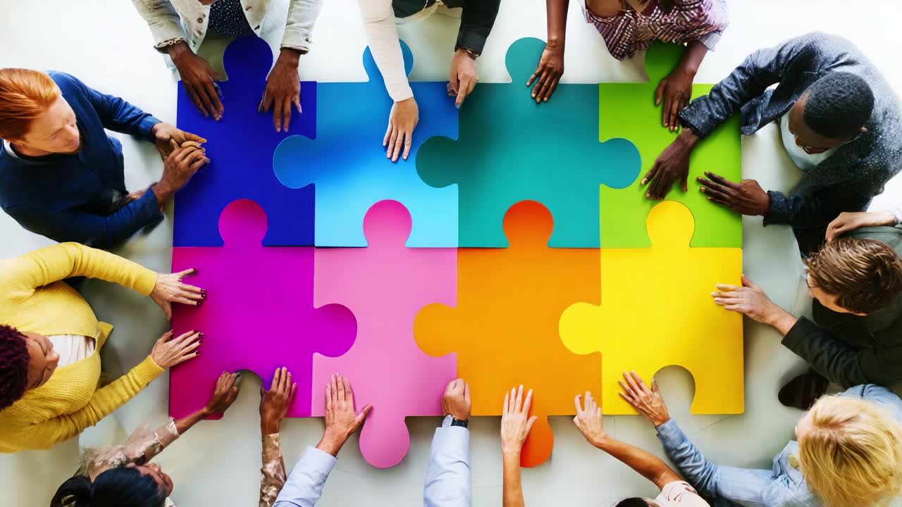 Team Collaboration as Individuals Unite to Assemble Vibrant Puzzle Pieces, Representing Unity, Diversity, and Creativity in Community Engagement and Problem Solving