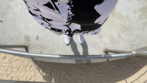 cropped portrait of male tourist at bondi beach in summer