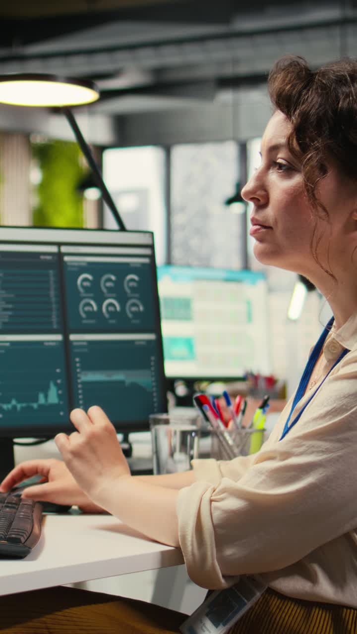 Vertical Video Administrator engages with financial data insights on a computer