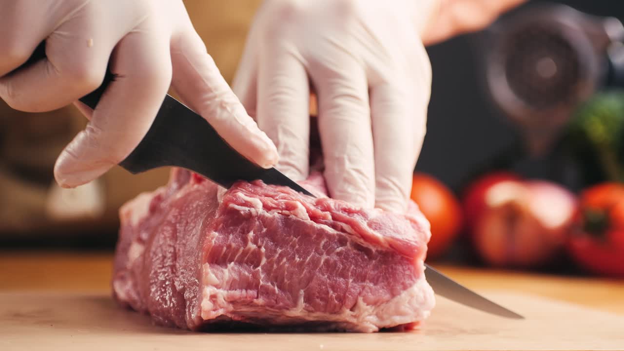 Chef Cutting Raw Pork