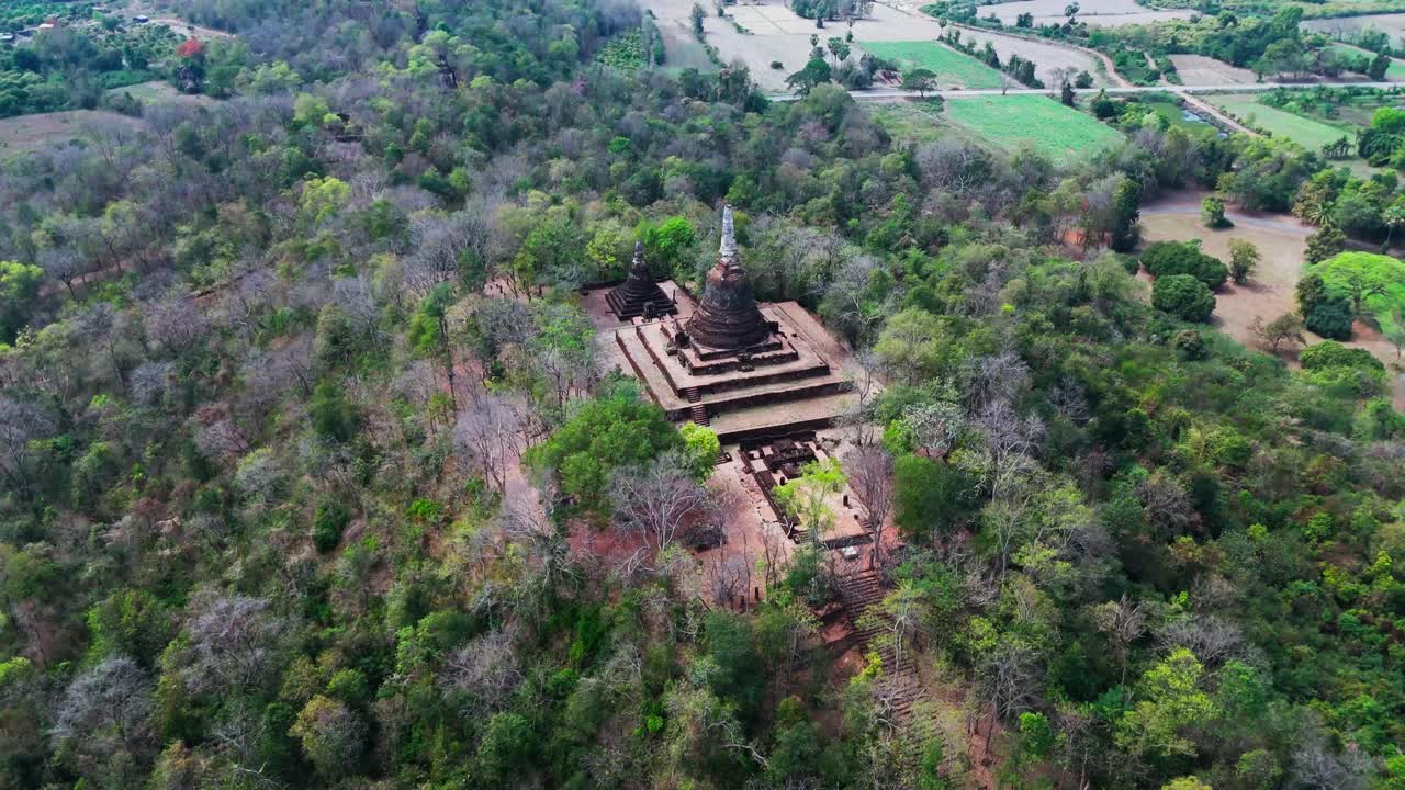 Aerial view of Sukhothai Thailand Si Satchanalai Historical Park, ancient ruins pagoda and temple aerial footage
