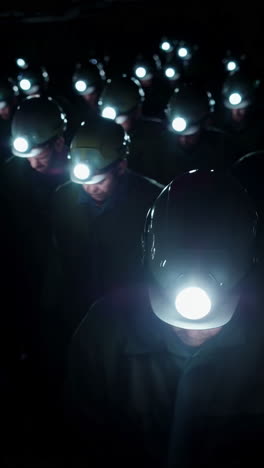 Miners with Headlamps in a Dark Environment