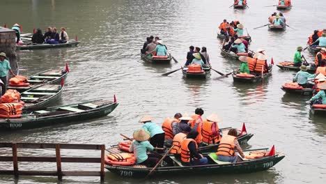tourists rowing boats on a tranquil river