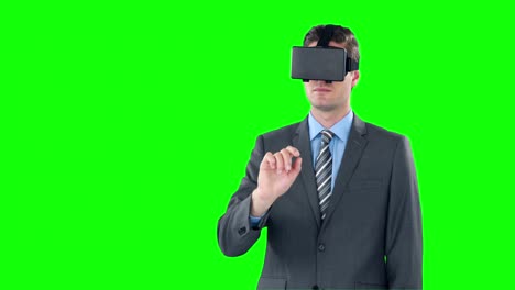 Happy-businessman-using-virtual-reality-headset