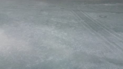 Klöntalersee-Glarus-Switzerland-sideways-view-of-melting-mirror-ice-lake