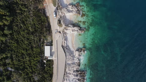 aerial beautiful coastline white sand, blue water rabac, croatia