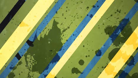 animation of yellow and blue stripes of paint on green background