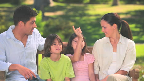 Cute-family-talking-outdoors