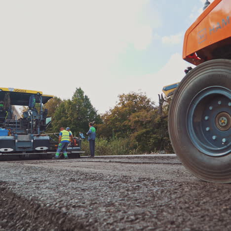road roller working with asphalt city roads. road roller carried repair works on city streets