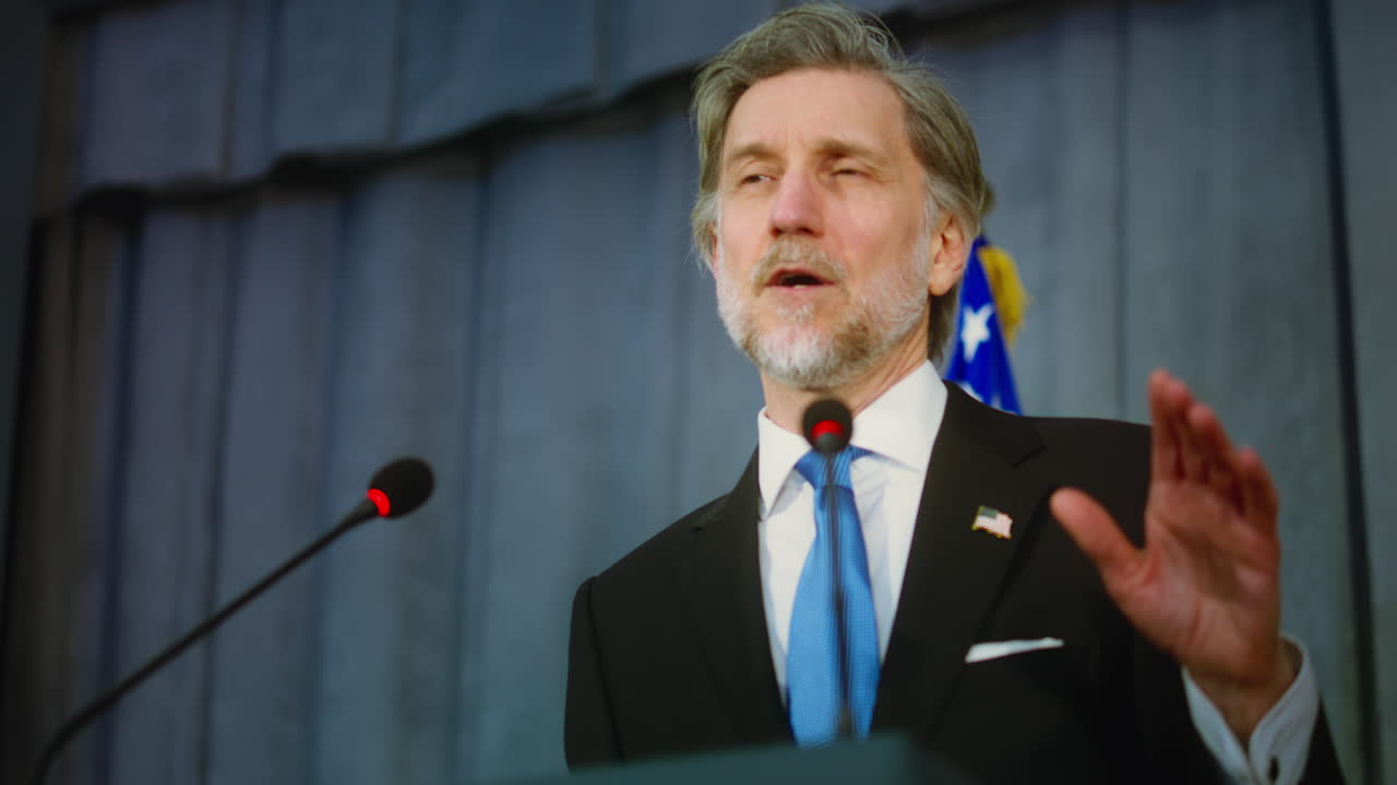Man giving a speech at a press conference