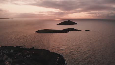 Aerial-view-of-rocky-cliffs-in-rippling-sea