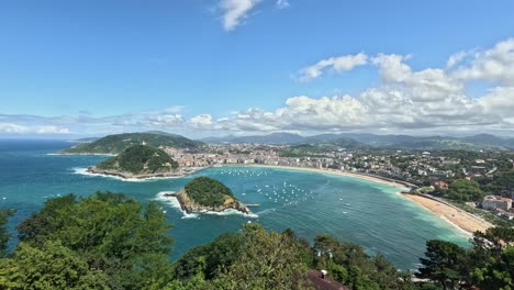 boats moor in la concha bay of coastal san sebastian city in spain
