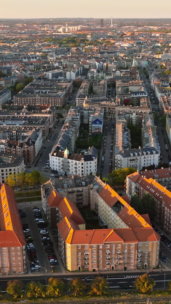 Aerial drone view of Vesterbro district in Copenhagen, Denmark at sunset. Vertical