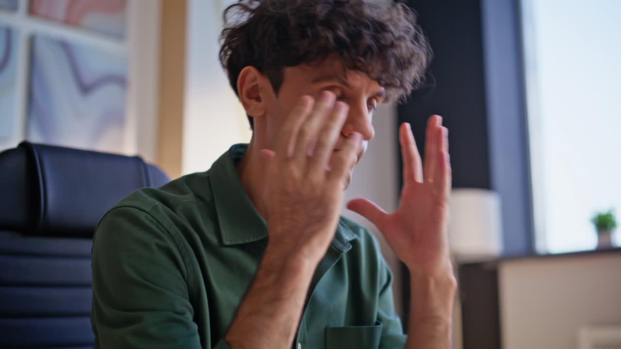 Frustrated entrepreneur reading papers at workplace closeup. Worried businessman