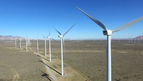 A-high-angle--aerial-over-a-Mojave-desert-wind-farm-as-it-generates-clean-energy-for-California