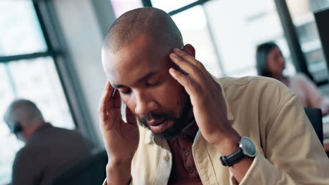 man with a headache in the office