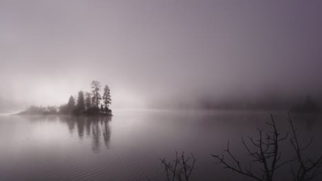 foggy dramatic scene looking across swan lake in montana