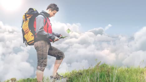 male hiker looking at map standing on hill video