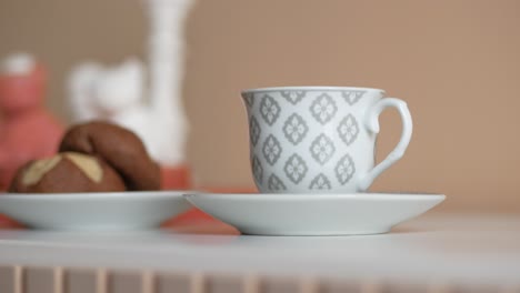 delicate coffee cup and cookies