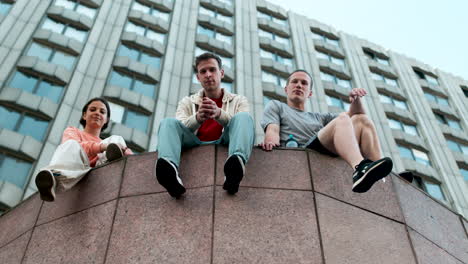 friends sitting on the street