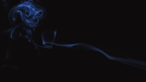 abstract blue smoke patterns on black background