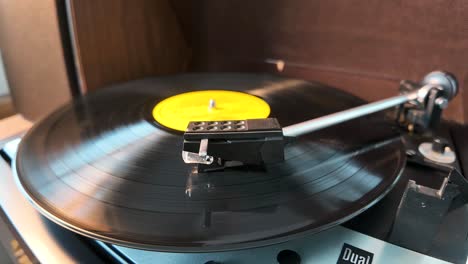 black vinyl retro record on dj turntable