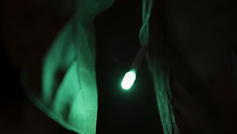 flickering single ferry light with dark background at night