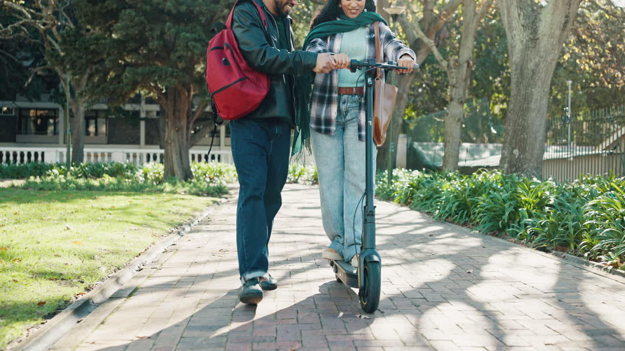 Couple riding electric scooter in park