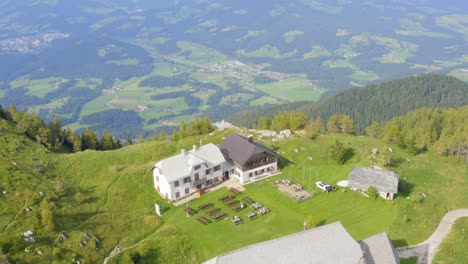 aerial pedestal up view of mountain lodge in ursula gora in slovenia