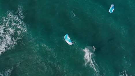 surfers riding waves in the ocean