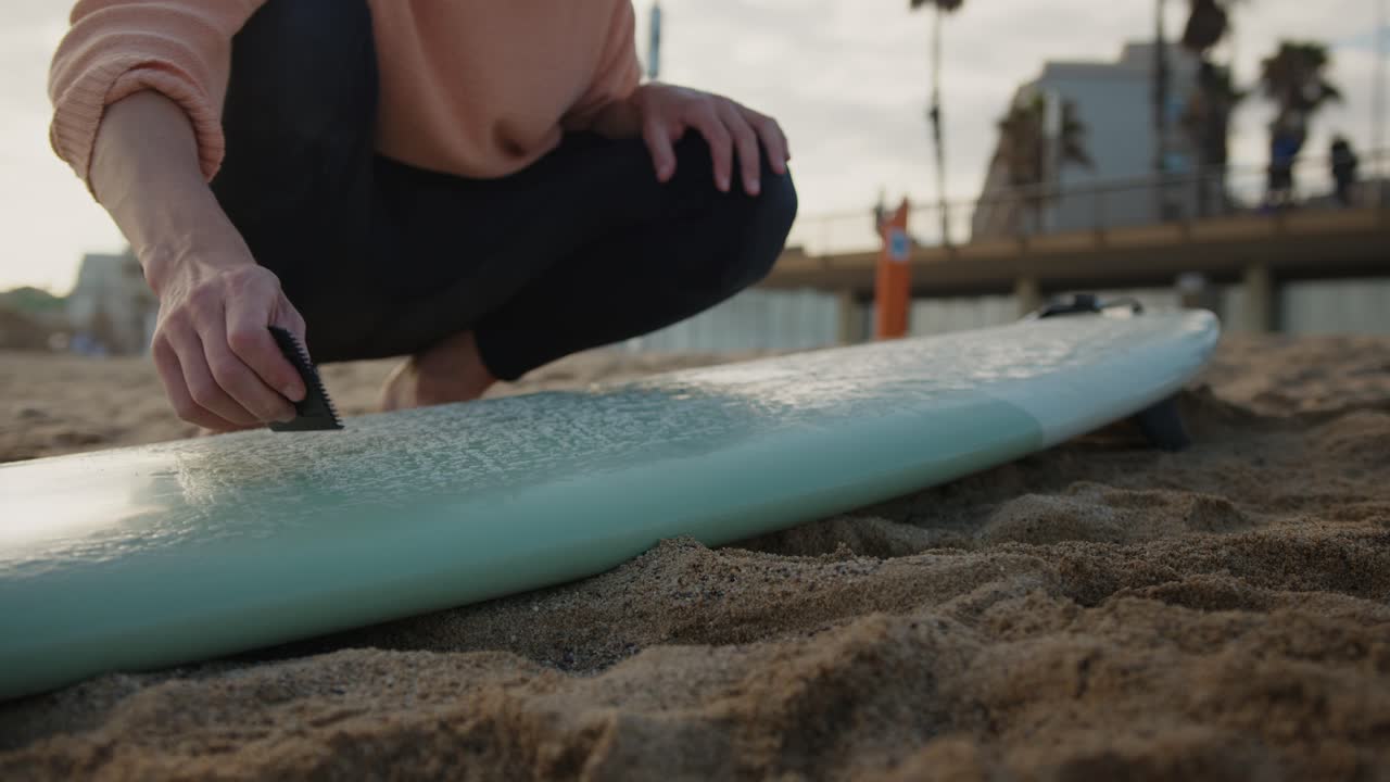 Surfer man walking to the beach at sunset preparing for surfing training and search for waves in Barcelona, spain, water, ocean exercise in sea with board, athletic male holiday or travel in vacation