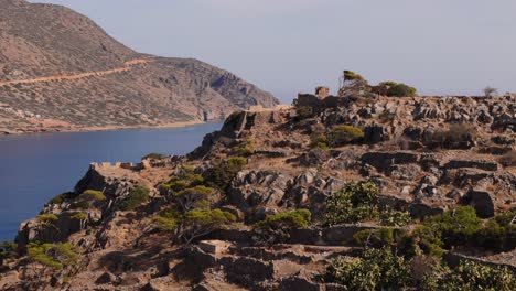 broken rock wall ruins remain a historic reminder of island fortress on spinalonga crete greece