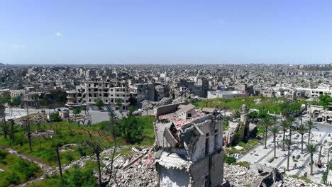 aerial view with a drone of the historic city centre of aleppo in syria. we still can see card and people living in the middle of the city 4k