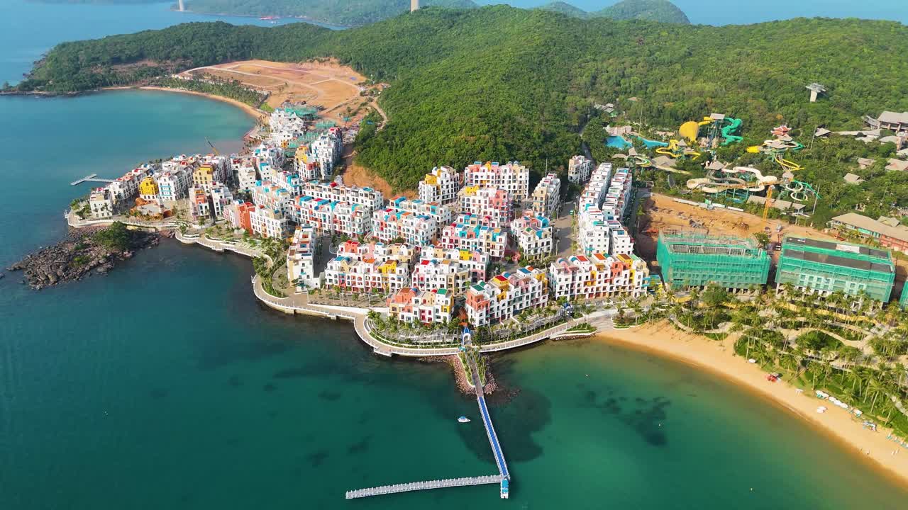 Drone shot of the VinHomes construction site on Phu Quoc Island, Vietnam, showcasing the ongoing development of a luxury resort designed with Santorini-style architecture.