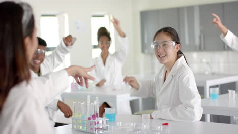 diverse students engage in a science experiment at high school during science class